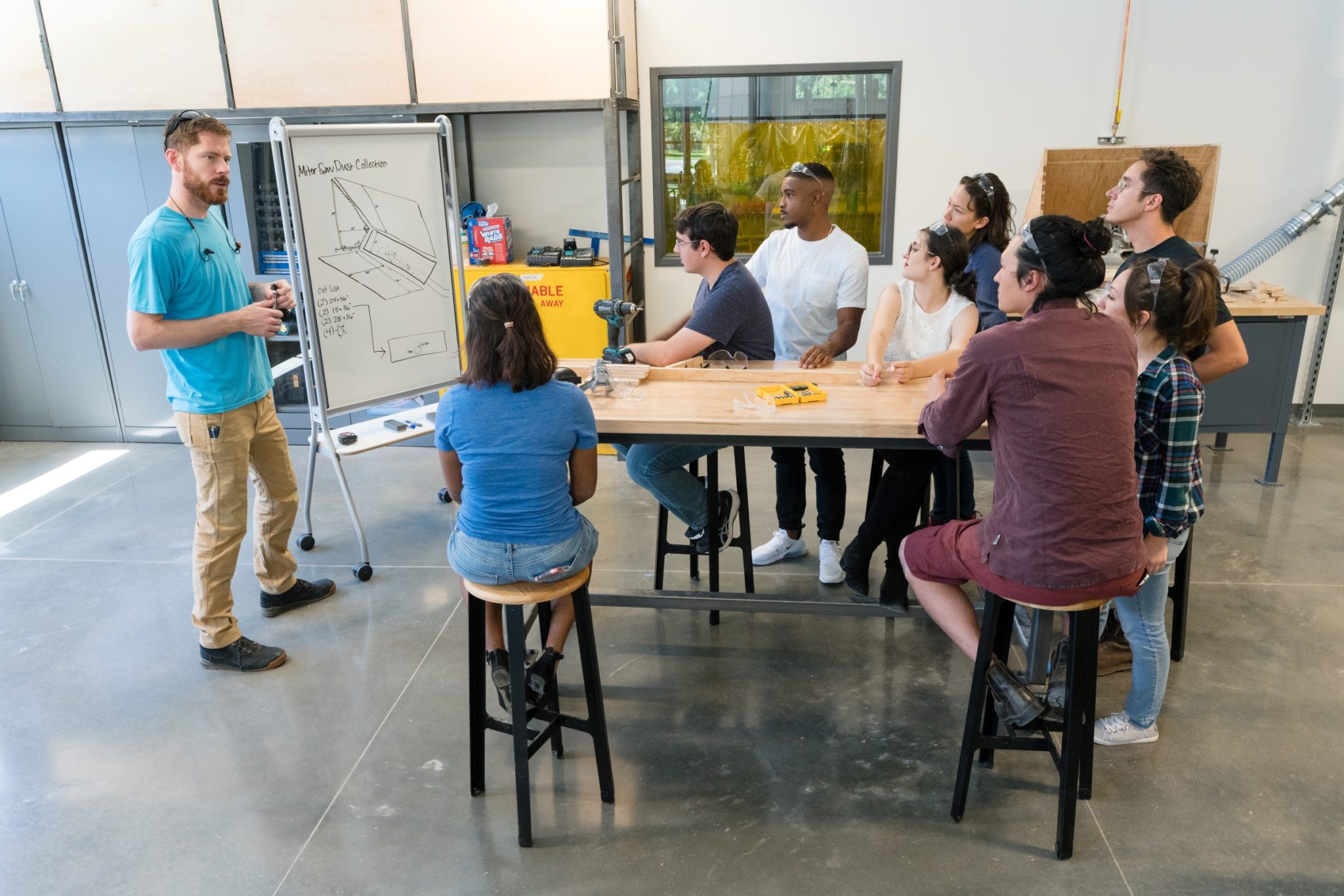 A diverse group of students participates in a design thinking workshop