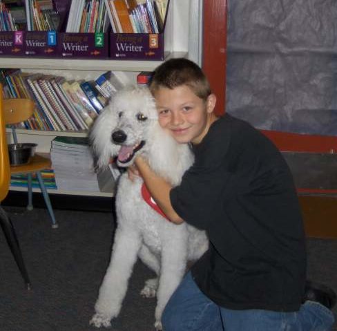 human-animal bond in colorado therapy dog with a school student