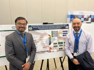 Kumar, on left with poster and Dr. Mehany on right