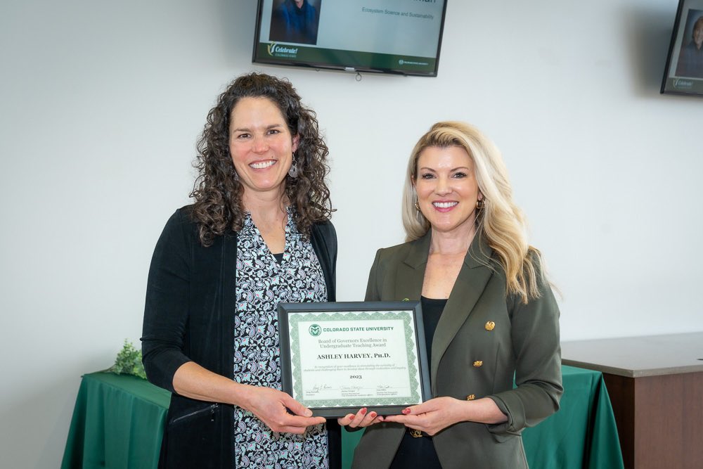 Ashley Harvey holds award with CSU President Amy Parsons