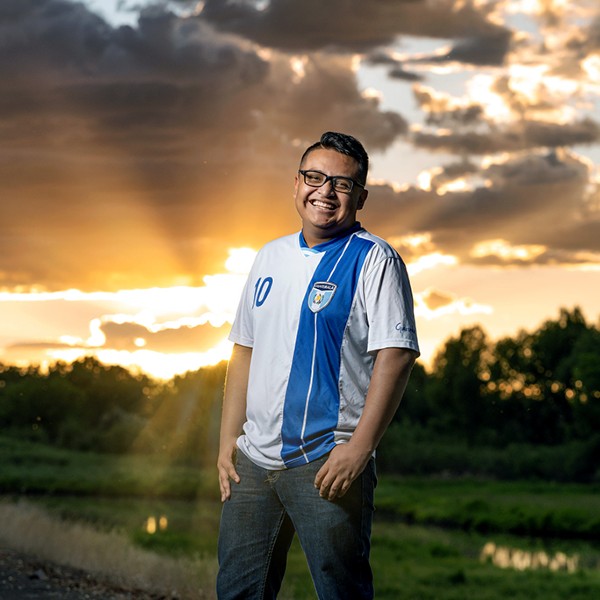 Eldin Lopez-Pascual posing for a photo in front of a sunset