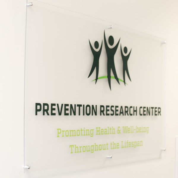 Sign for the Prevention Research Center that says 'Promoting health and well-being throughout the lifespan'