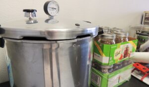 A pressure cooker and canning jars