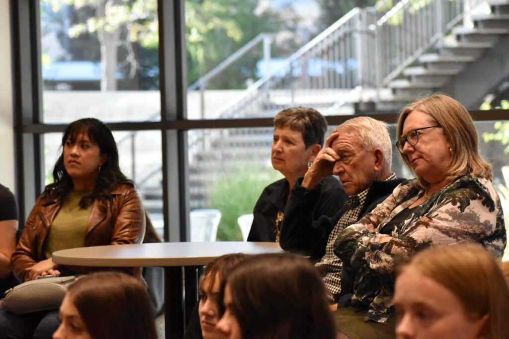 Diana Cruz, Antigone Kotsiopulos, Jerry Culp, and Dean Lise Youngblade listen in the audience.