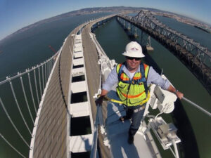 Chris Smith on top of bridge doing a site safety walk