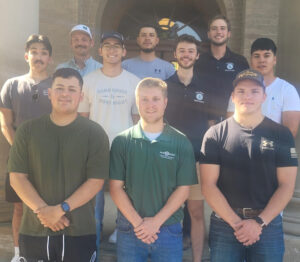 10 member all male team in CM Cares fall 2023 service-learning class