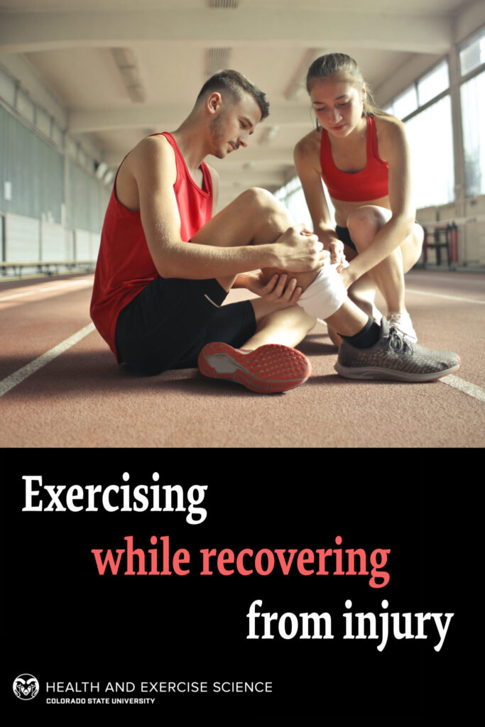 Exercising while recovering from injury - two people kneel to look at a minor injury to the leg on a track 