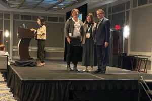 Kristen Morris and Morgan Davis accepting their award at ITAA