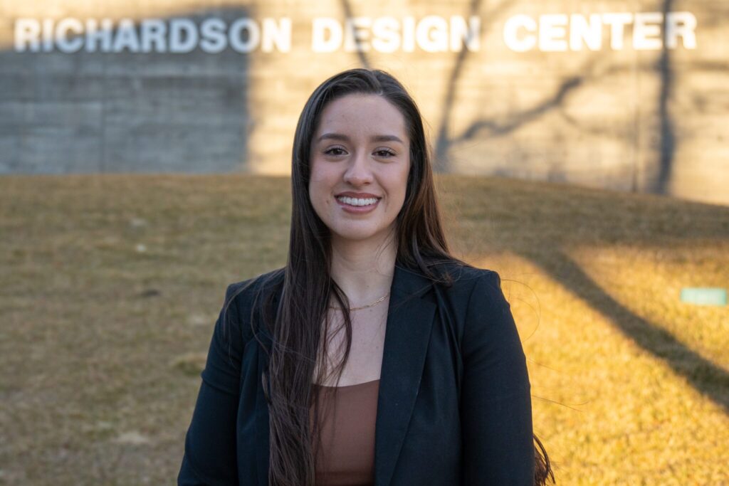 Outstanding Interior Architecture and Design student Karime Marrufo smiles outside of the CSU Richardson Design Center.