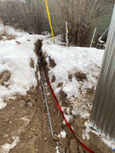 Conduit laid in a ditch for utilities to the Wiley Acres restroom project