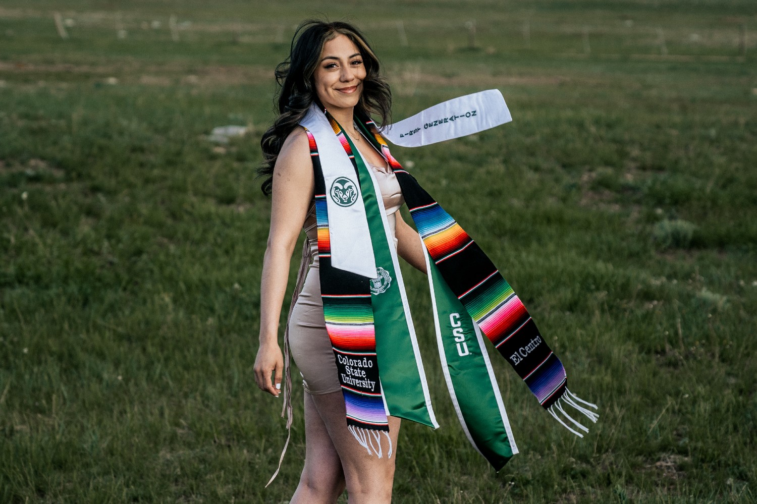Jenni Zarate outdoors wearing her graduation stoles