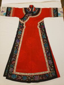 A red silk robe with floral details