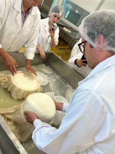 People in White coats form cheese